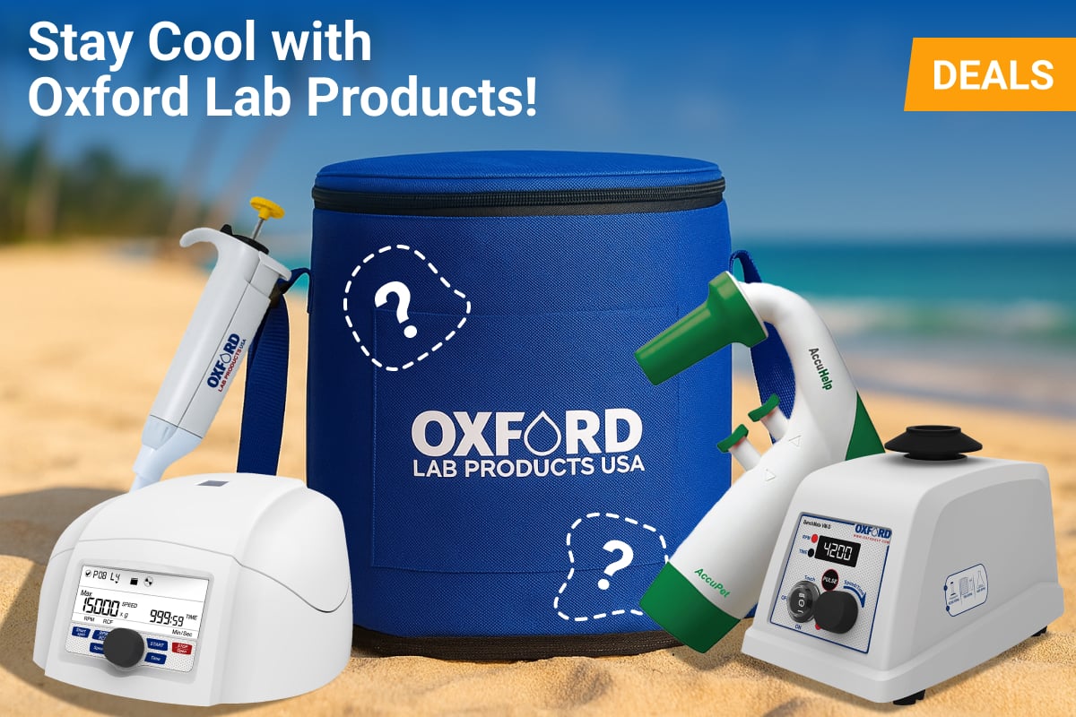 A summer-themed promotional image featuring various Oxford Lab Products on a sandy beach. A large, blue Oxford Lab cooler bag is in the center, surrounded by a white centrifuge, a pipette, a green and white pipette controller, and a vortex mixer. Text on the image reads ‘Stay Cool with Oxford Lab Products’ and a yellow banner says ‘DEALS.’